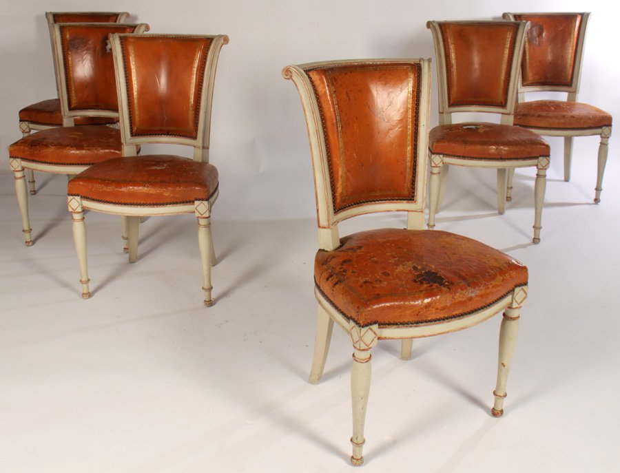 SET 6 LEATHER CARVED PAINTED DINING CHAIRS 1920: A very good set of six leather Directoire style carved and painted dining chairs with gilt and nail head decorated backs and seats circa 1920. Supported on turned legs. Ht: 35" Width: 19" Depth: 27"Se