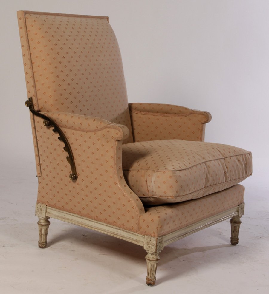 LOUIS XVI RECLINING BERGERE CHAIR 1940: Interesting Louis XVI style reclining bergere chair having adjustable back and loose cushion seat circa 1940. Raised on turned and fluted legs. Ht: 39" Width: 29" Depth: 25"