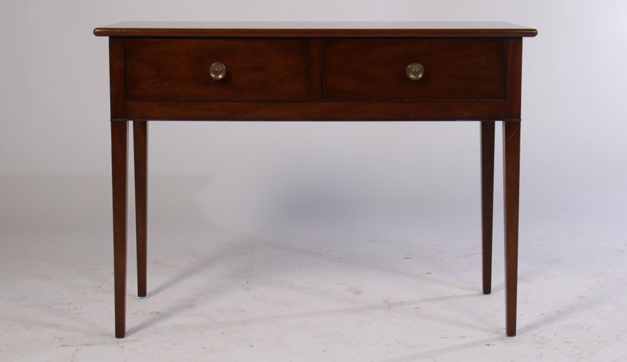 BRANDED KITTINGER WILLIAMSBURG HUNT BOARD: A branded 'Kittinger Williamsburg' hunt board having two drawers supported on tall tapered legs. Ht: 35" Width: 48" Depth: 20.5"