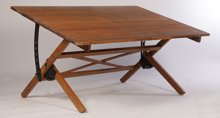 VINTAGE MECHANICAL ARCHITECTS DRAFTING TABLE 1915: A vintage mechanical architects drafting table having adjustable top over single drawer supported on cast iron and wood base circa 1915. Ht: 30" Width: 72" Depth: 48"