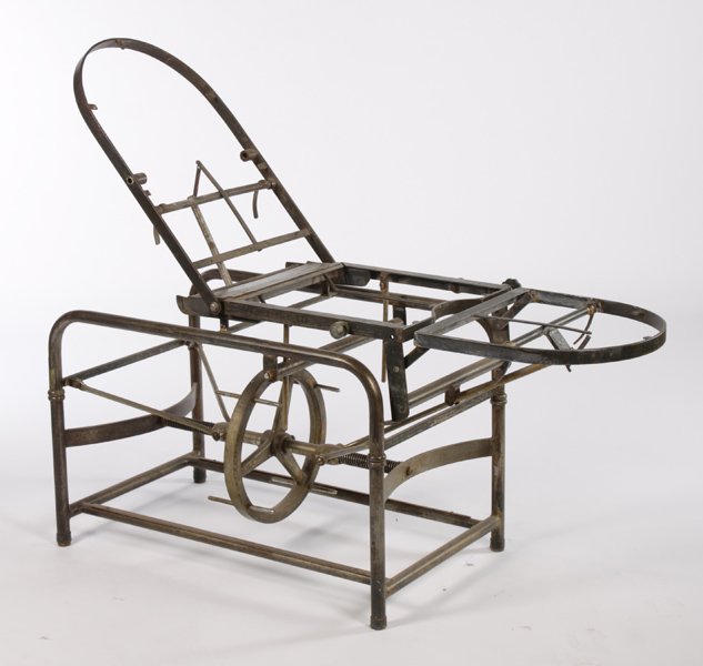 VINTAGE INDUSTRIAL METAL MECHANICAL TABLE BASE: A vintage industrial metal mechanical table base having a adjustable central wheel circa 1920. Ht: 27" Width: 65" Depth: 23"