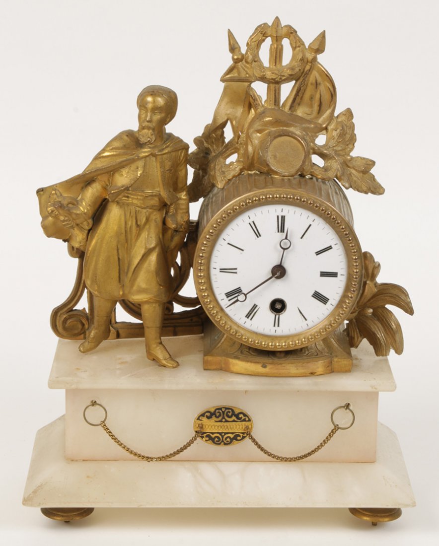 WHITE METAL 19TH C. FRENCH MANTLE CLOCK MALE: A white metal nineteenth century French mantle clock featuring a cloaked male figure atop alabaster base with swag chains. Ht: 11" Width: 9" Depth: 4"