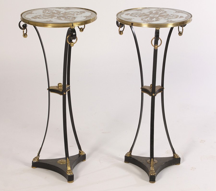 PAIR REGENCY WROUGHT IRON BRONZE GUERIDONS C.1950: A pair of Regency style wrought iron and bronze gueridons having eglomise decorated mirrored tops with stylized foliate design circa 1950. All supported on downswept legs with paw feet and raised plin