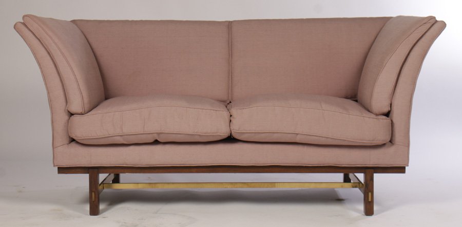 EDWARD WORMLEY FOR DUNBAR FLARED ARM SOFA 1970: An unusual upholstered settee attributed to Edward Wormley for Dunbar having flared arms supported by a walnut and bronze stretcher circa 1970. Ht: 33.5" Width: 73" Depth: 33" From a prominent Delawar