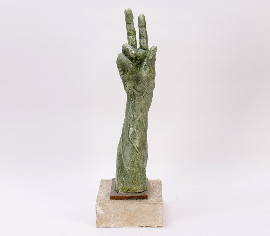 LARGER PLASTER HAND INSPIRED GEORGE SEGAL: A large plaster hand inspired by George Segal having two upraised fingers mounted on copper and plaster base. Ht: 26" Width: 8" Depth: 9"