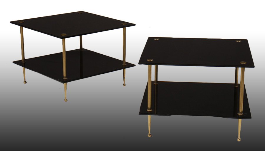 PR OF MID CENTURY MODERN END TABLES C. 1970: A pair of mid century modern bronze and black glass two tiered end tables circa 1970. Ht: 30.5" Width: 27.5" Depth: 23.5"
