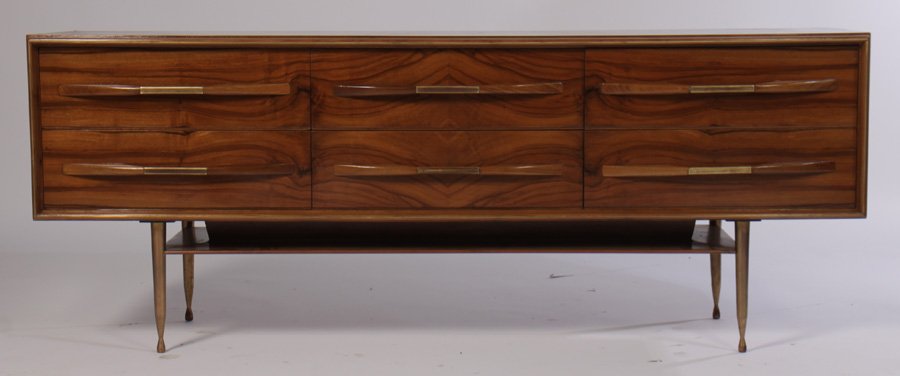 MODERN CREDENZA 6 DRAWERS BRONZE LEGS 1960: A mid century modern credenza having six drawers with bronze and wood handles supported on bronze tapering legs circa 1960. Ht: 27.5" Width: 72" Depth: 17.5"