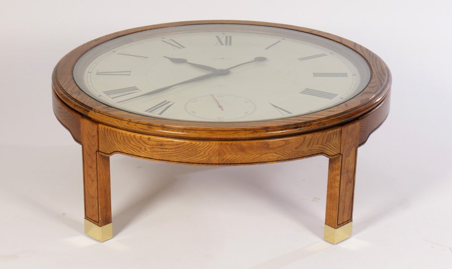HOWARD MILLER CLOCK FACE COFFEE TBLE 1970: A Howard Miller clock face coffee table circa 1970. Ht: 16" Width: 41"