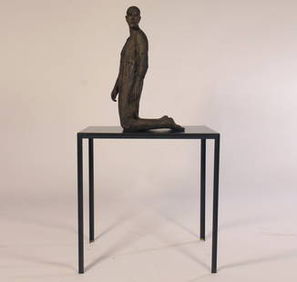 HANNEKE BEAUMONT KNEELING MAN BRONZE FIGURE: Hanneke Beaumont (Belgium/Italy/Netherlands, B. 1947) "Kneeling Man" bronze figure on metal table, signed H.B. Initialed and marked 4/8 with small foundry stamp (completely illegible) Accompanied by E