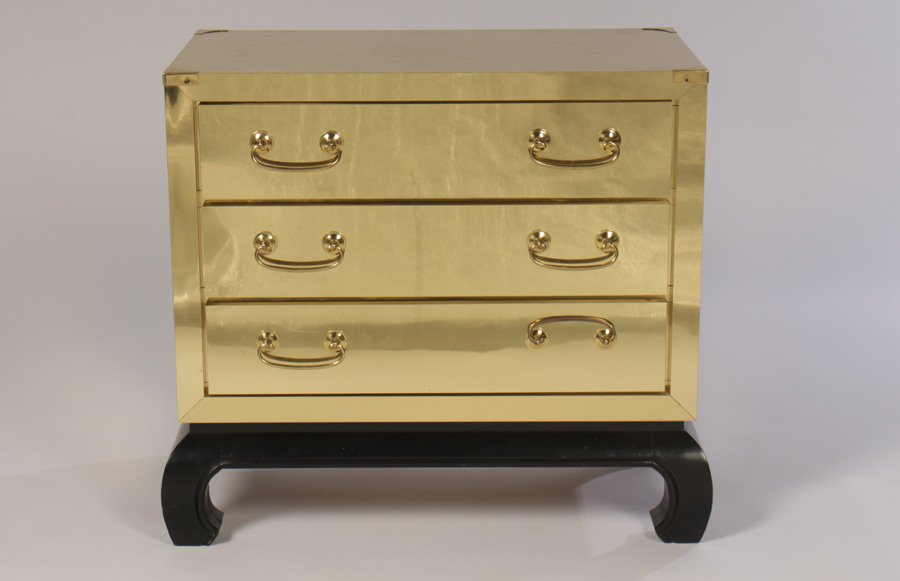3 DRAWER BRASS & WOOD ASIAN INSPIRED CHEST 1980: A three drawer brass and wood Asian inspired chest in the manner of James Mont circa 1980. Ht: 28" Width: 30" Depth: 17"