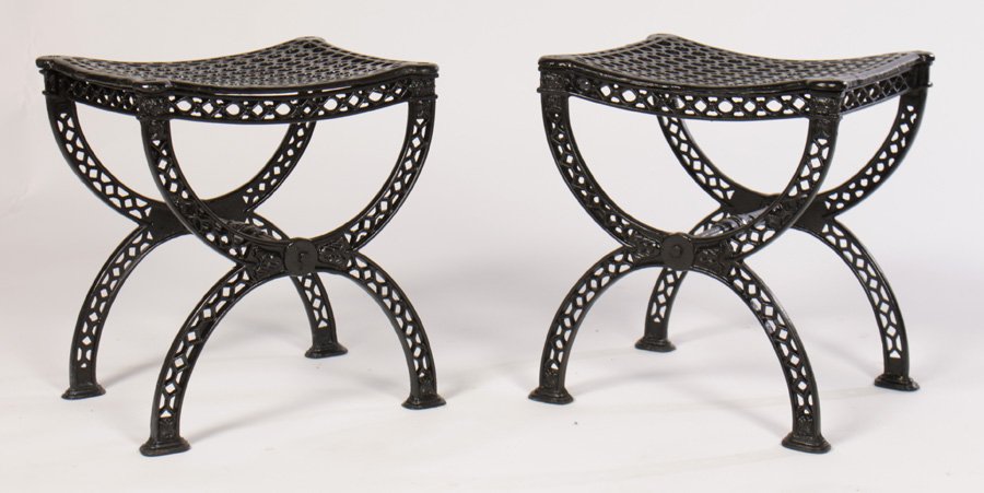 PAIR CAST IRON STOOLS BENCHES HONEYCOMB: A stylish pair of cast iron stools/benches having honeycomb open work seats supported by curule base and paw feet. Dimensions: Ht: 18" Width: 16" Depth: 14"