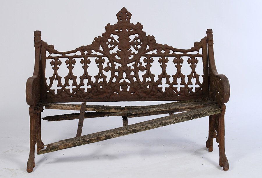 GOTHIC CAST IRON GARDEN BENCH PLANK SEAT 1890: A gothic style cast iron garden bench with remnants of wood plank seat circa 1890. Ht: 37" Width: 46" Depth: 20"