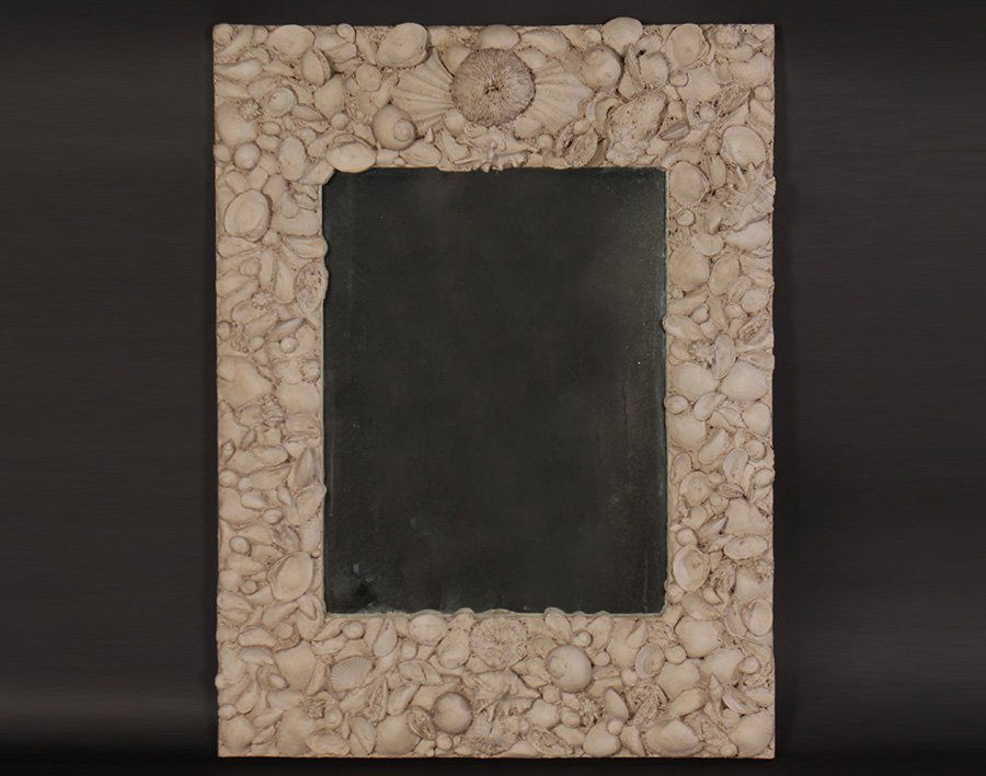 COMPOSITE SHELL FORM MIRROR DAVID HICKS: A composite shell form mirror inspired by David Hicks. Ht: 43" Width: 32"