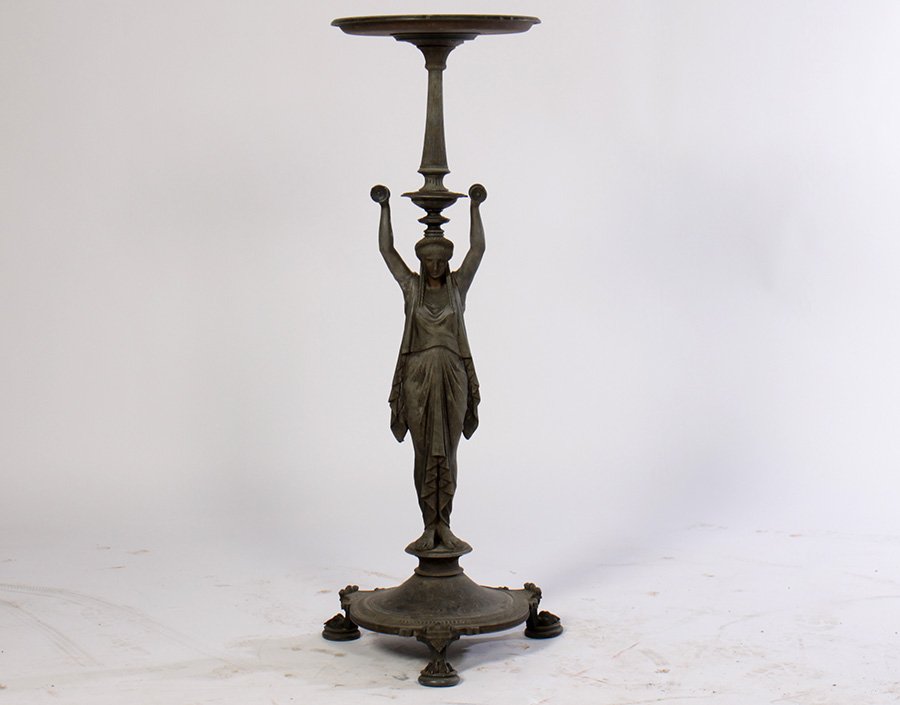 19TH C. CAST ZINC FIGURAL STAND DISH TOP: A very good late nineteenth century Neoclassical cast zinc figural stand having dish top supported by female with upraised arms and draped gown. Raised on decorated round base with paw feet. Ht: 44" W