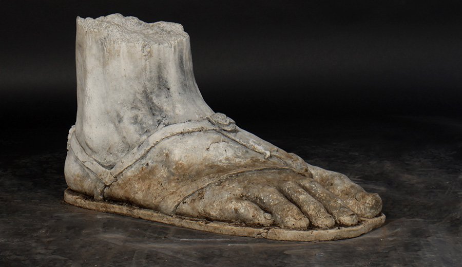 LARGE CAST STONE ROMAN CLASSICAL FOOT SANDAL: An interesting large scale architectural cast stone Roman inspired classical foot with sandal. Ht: 19.5" Width: 14" Depth: 36"