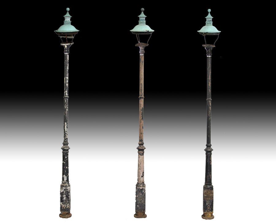 3 LATE 19TH C. STREET LIGHTS COPPER PAGODA TOP: A lot of three late nineteenth century Continental street lights having copper pagoda form lantern tops supported by cast iron cluster form columns. Ht: 160" Dia: 22"