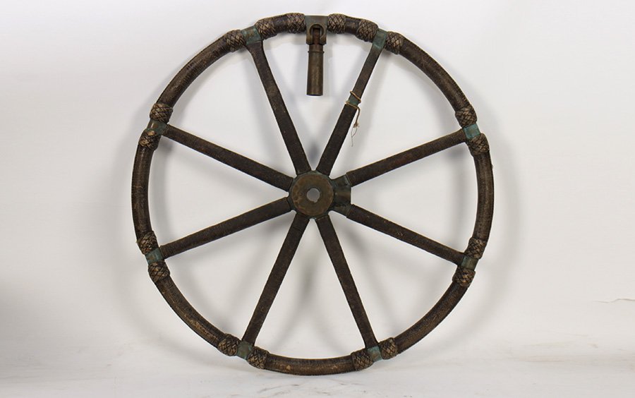 BRONZE NAUTICAL SHIPS WHEEL ROPE WRAPS 1920: A bronze nautical ships wheel with rope wraps and knot decoration circa 1920. Dia: 33"