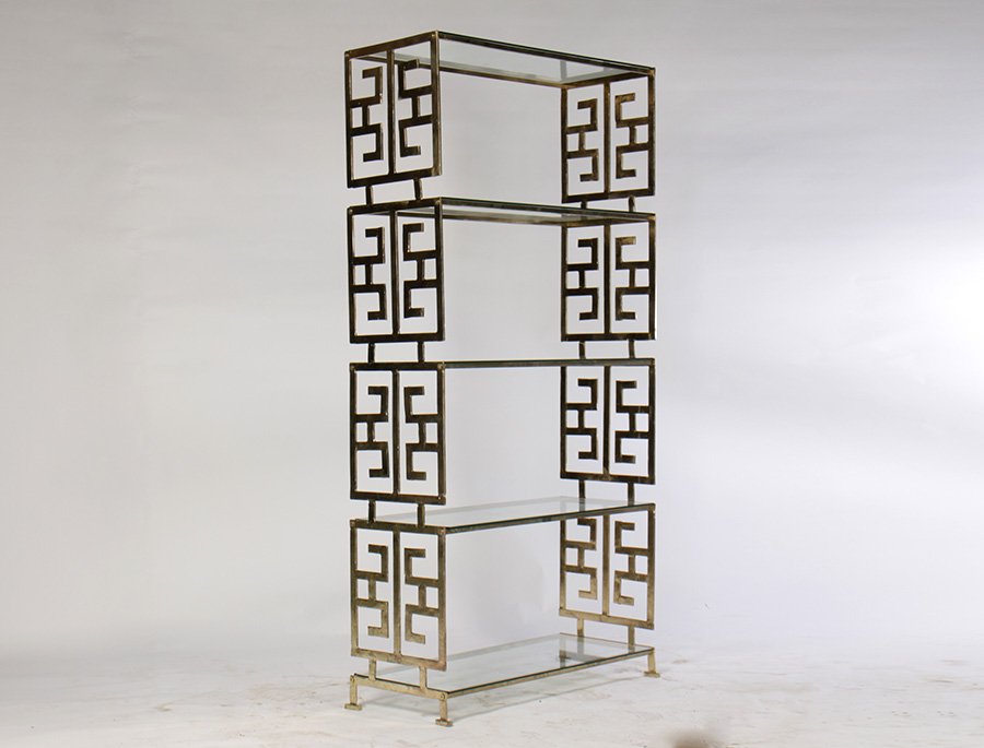 MID CENTURY METAL ETEGERE GLASS SHELVES GREEK KEY: A mid century modern style metal etegere having glass shelves and Greek key decorated sides. Ht: 72.5" Width: 35.5" Depth: 15"