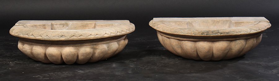 PAIR CARVED MARBLE DEMILUNE FOUNTAIN BASES: A pair of carved marble demilune fountain bases, each having egg and dart border over lobed bowl. Ht: 8" Width: 27" Depth: 18"