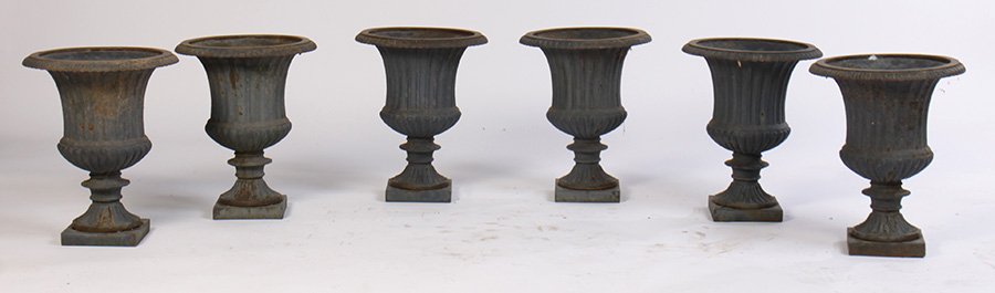SET 6 CAMPANA FORM CAST IRON GARDEN URNS: A set of six campana form cast iron garden urns, all with egg and dart rim and flared bodies. Ht: 18.5" Dia: 15"