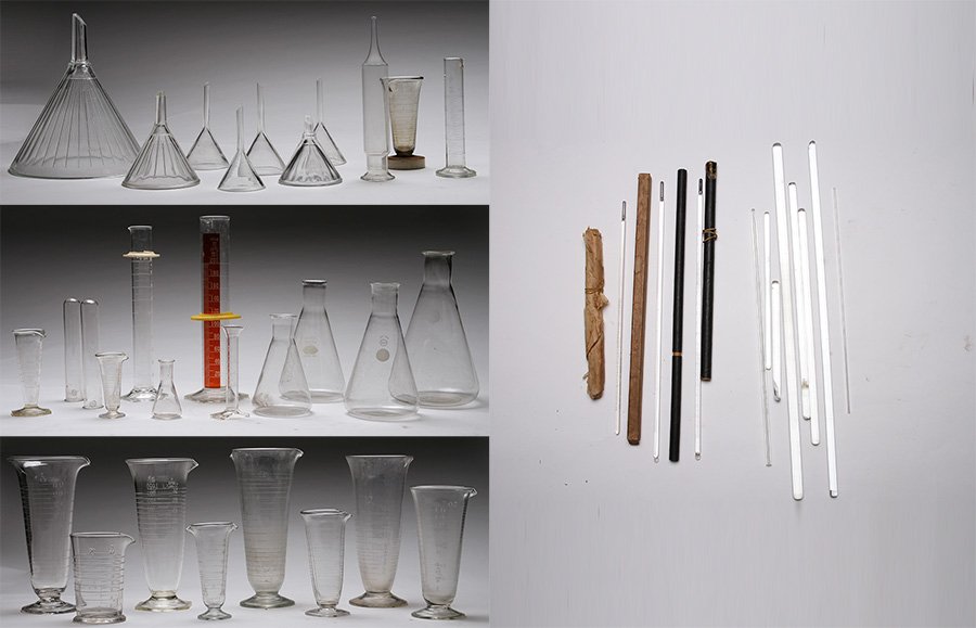 COLLECTION OF CHEMISTS GLASS MEASURES FLASKS RODS: Amazing collection of chemist's glass measures. Consisting of graduated measures, flasks, cylinders, funnels, pipettes, and rods. Forty-two pieces in total. Ht: 11.75" (largest)