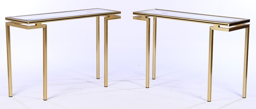 PAIR LABELED PIERRE VANDEL CONSOLE TABLES 1970: A pair of labeled "Pierre Vandel, Paris" brass console tables, each having inset beveled glass tops with ebonized trim circa 1970. Ht: 29" Width: 43.5" Depth: 14"