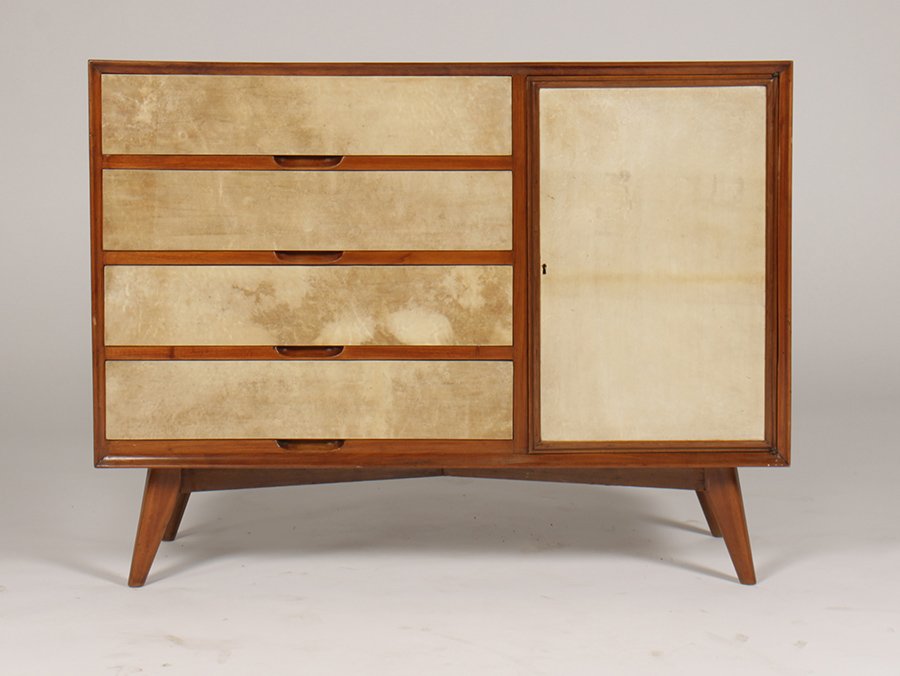 ITALIAN MID CENTURY COMMODE PARCHMENT FRONT 1960: An Italian mid century modern commode having four parchment front drawers and a single door all raised on turned and flared legs circa 1960. Ht: 33" Width: 43" Depth: 18"