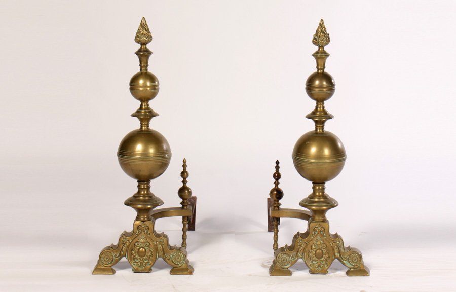 PAIR BRASS ANDIORNS DUTCH TASTE FLOWER FINIALS: A pair of brass andirons in the Dutch taste having flower finials circa 1910. Ht: 29.5"" Width: 11.5""