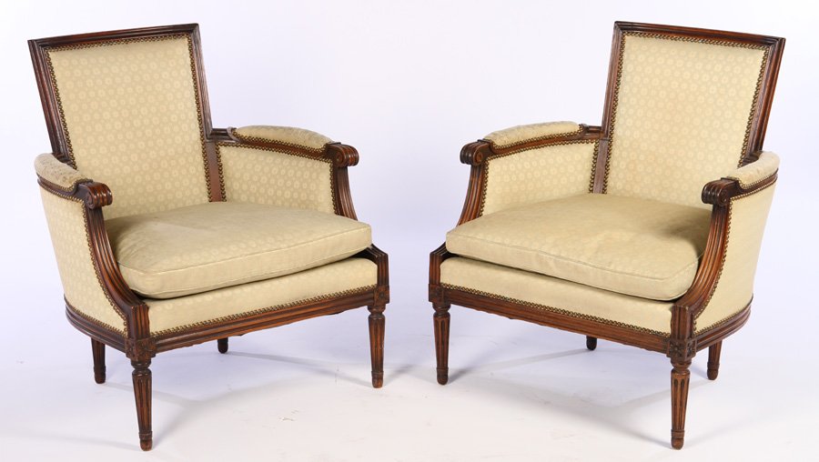 PAIR LOUIS XVI BERGERE CHAIRS LOOSE CUSHION SEATS: A pair of Louis XVI style bergere chairs with nail head decoration and loose cushion seats. Seat height: 17" Provenance: From the original collection of the Maybrook mansion in Wynnewood, Pennsylvania
