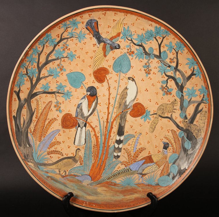 LARGE NICELY DECORATED BIRD THEMED CHARGER: A large and nicely decorated bird themed charger, signed en verso. Provenance: From the original collection of the Maybrook mansion in Wynnewood, Pennsylvania. The 20,000 square foot Gothic mansion wa