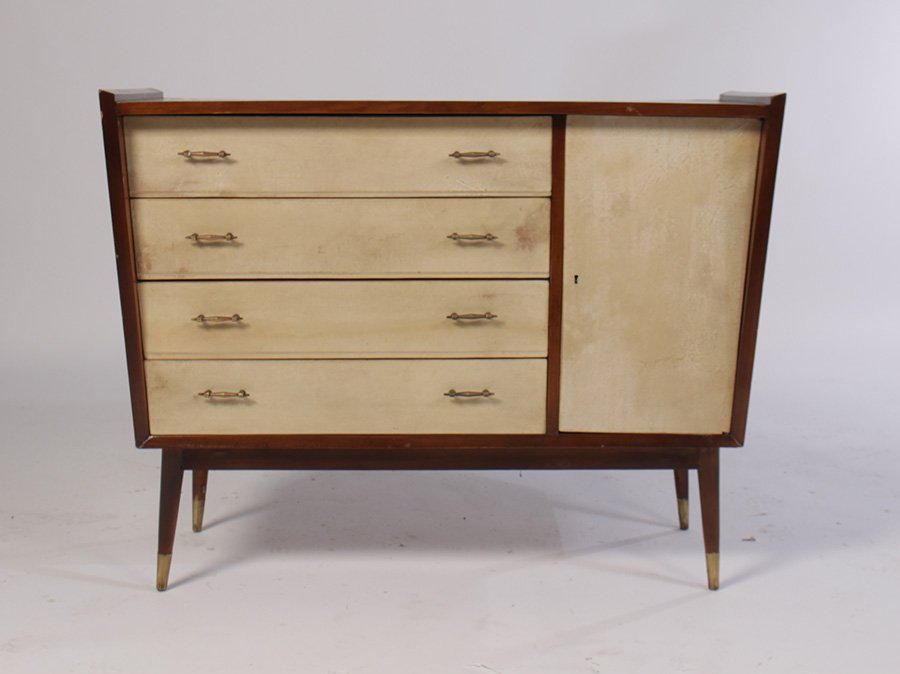 MODERN COMMODE 4 DRAWERS PARCHMENT COVERED 1960: Mid century modern parchment covered commode having four drawers with brass pulls and one blind drawer circa 1960. Raised on a conical leg with brass foot. Ht: 33.5" Width: 40" Depth: 16"