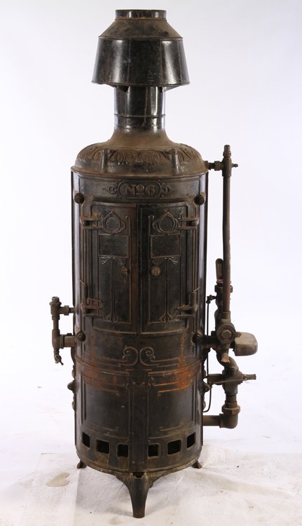 ANTIQUE ROUND CAST IRON WATER HEATER MODEL #6: Antique round cast iron water heater model #6. Provenance: From the original collection of the Maybrook mansion in Wynnewood, Pennsylvania. The 20,000 square foot Gothic mansion was originally built o