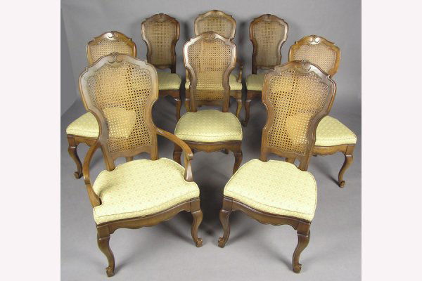 8 FRUITWOOD CANE BACK DINING ROOM CHAIRS CHAIR: SET OF EIGHT FRUITWOOD CANE BACK DINING ROOM CHAIRS CIRCA 1960. Consisting of six side chairs and two arm chairs H: 43" W: 22.5" D: 24" *Condition: Good *Est. Sale Time: 11:01 AM Eastern
