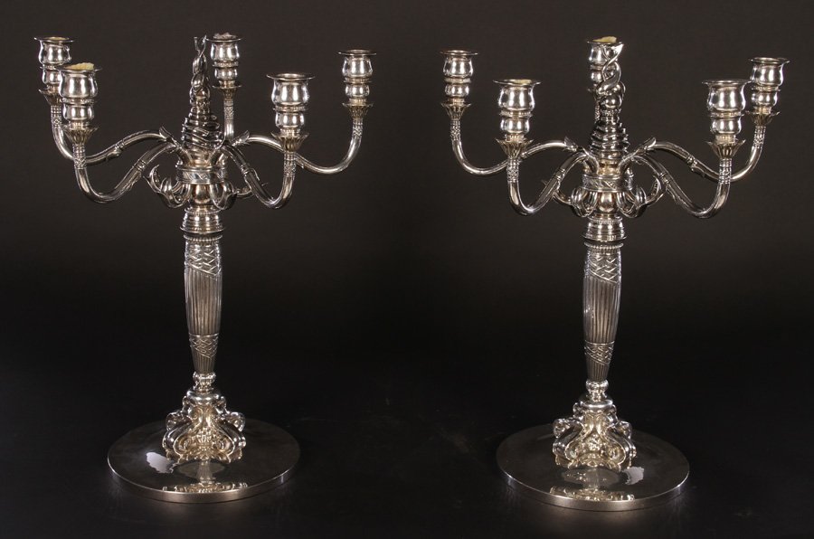 GEORG JENSEN/JOHAN ROHDE 224 SILVER CANDELABRA C.1920: A Georg Jensen/Johan Rohde 224 matched pair of sterling silver five-arm candelabra circa 1920. Having scrolling branch ornamentation, fluted spiraling center support terminating in intertwining dolphi