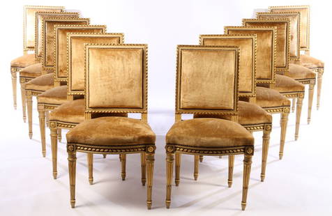 SET 12 FRENCH CARVED LOUIS XVI DINING CHAIRS 1940: A set of twelve French carved and painted Louis XVI style dining chairs, each having giltwood decorated rope twist decoration circa 1940. Having velvet upholstered back and seat. Ht: 35.5" Wd: 20" Dpt