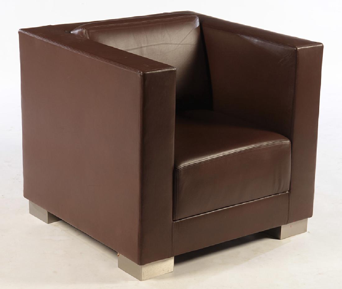 LEATHER UPHOLSTERED CUBIST TAILORED CLUB CHAIR: A leather upholstered cubist form tailored club chair. Ensuite Ht: 29.5" Wd: 32" Dpth: 32"