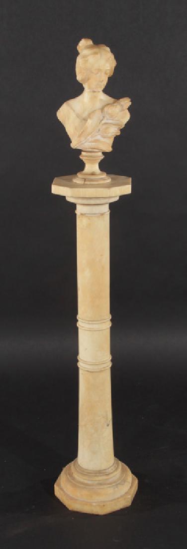 CARVED ALABASTER BUST OF A WOMAN 1890: A carved alabaster bust of a woman with foliate adornments atop matching octagonal column circa 1890. Ht: 52" Dia: 10"
