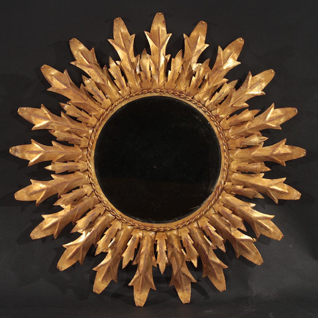 A GILT METAL SUBURST FORM MIRROR (1 of 2)