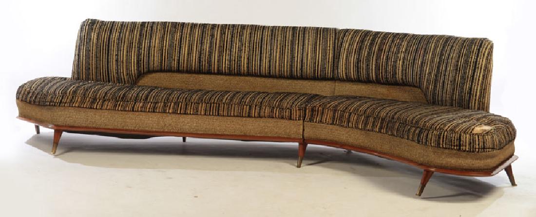 ITALIAN MODERN CURVED SOFA FEDERICO MUNARI (ATTR): An interesting Federico Munari (attr.) mid century modern Italian two part modular curved sofa circa 1960. Having a wood trimmed base and tapered legs with bronze sabots. Ht: 31.5" Wd: 136" Dpth: 28"