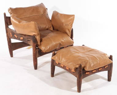 SERGIO RODRIGUEZ LOUNGE CHAIR & MATCHING OTTOMAN: A good Sergio Rodriguez lounge chair and matching ottoman, both with leather strapping and vinyl cushions. Ht: 30" Wd: 30" Dpth: 31" Seat: 16"