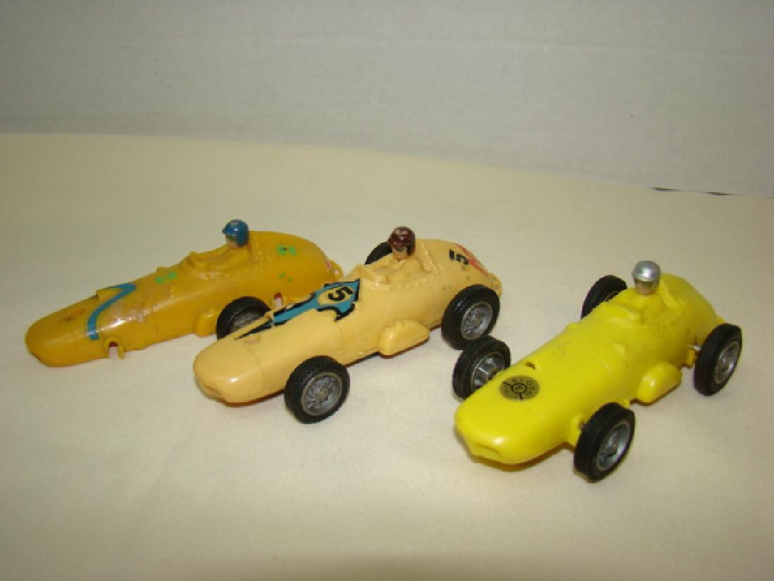 ELDON INDY RACE CARS: ELDON INDY RACE CARS-BEIGE -TAN - YELLOW CAR APPEARS COMPLETE WITH LABEL -NO MAJOR FLAWS-BEIGE #5 IS WORN AND WHEELS ARE LOOSE-TAN CAR IS BODY ONLY AND SHOWS MAJOR WEAR-NO WHEELS