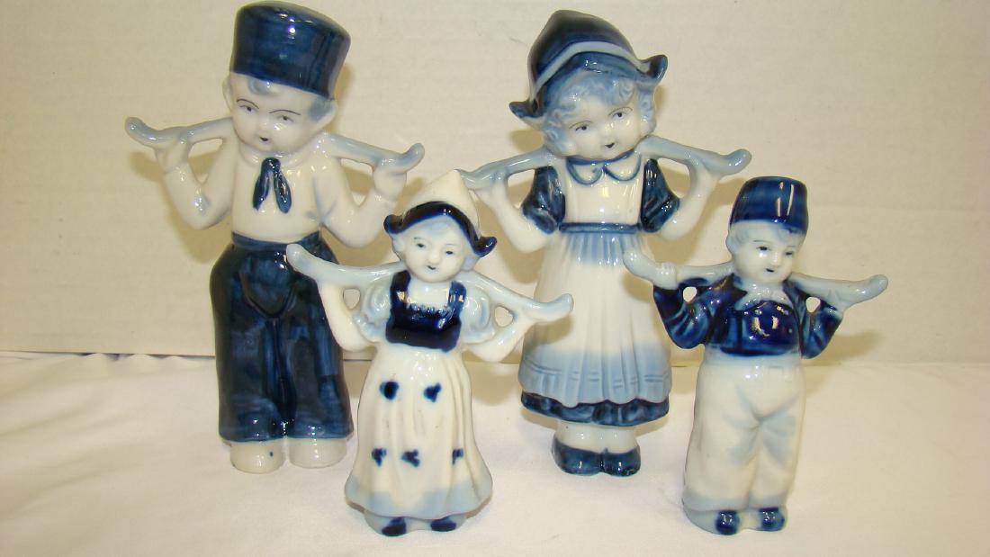 2 SET VINTAGE FLOW BLUE DUTCH WATER BOY AND GIRL: 2 SETS VINTAGE FLOW BLUE DUTCH WATER BOY AND GIRL - 1 SET STANDS 4 & 1/2 IN TALL - 1 SET STANDS 6 & 1/2 IN TALL - MADE IN JAPAN - GREAT CONITION