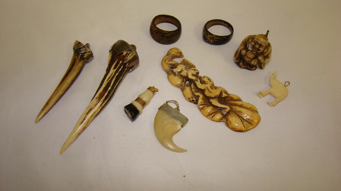 CARVED WOODEN RINGS - BUDDAH PENDANT AND MORE: 2 CARVED WOODEN RINGS - SIZE 10 1/2 - 1 1/2 IN BUDDAH PENDANT - WHITE ELEPHANT PENDANT - HORSE'S HOOF PENDANT - AND MORE