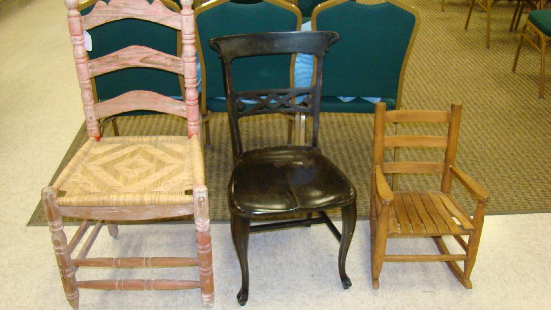 3 ANTIQUE CHAIRS - BLACK ENAMEL - CHILD'S WOODEN: 3 ANTIQUE CHAIRS - BLACK ENAMEL CHAIR WITH CURVED FOOT FRTON LEGS - CARVED BACK - STANDS 32 IN TALL X 16 IN WIDE - SHOWS NORMAL WEAR - CHILD'S WOODEN ROCKING CHAIR HAS SLATTED SEAT - 23 IN TALL X 14 I