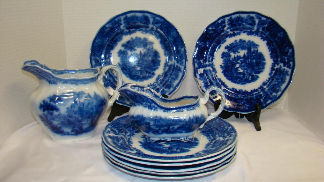 FLOW BLUE BURGESS & LEIGH NONPAREIL DINNER PLATES: FLOW BLUE BURGESS & LEIGH NONPAREIL DINNER PLATES - 7 IN ALL - EXCELLENT CONDITION - SOME FLAWS - NO CHIPS OR CRACKS - GRAVEY BOAT SHOWS SOME BROWNING - SMALL CHIP IN HANDLE - MINOR FLAWS - PITCHER IS