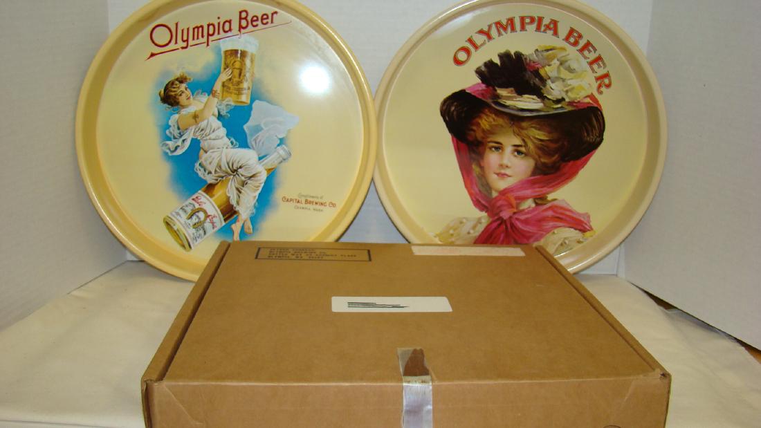 VINTAGE OLYMPIA BREWING CO TRAYS: 2 VINTAGE OLYMPIA BREWING CO BEER TRAYS - ONE TRY IS THE 1909 CALENDAR GIRL SERVING TRAY AND ONE IS THE FLYING LADY CALENDAR GIRL SERVING TRAY - BOTH IN PRISTINE CONDITION - STILL IN ORIGINAL MAILING