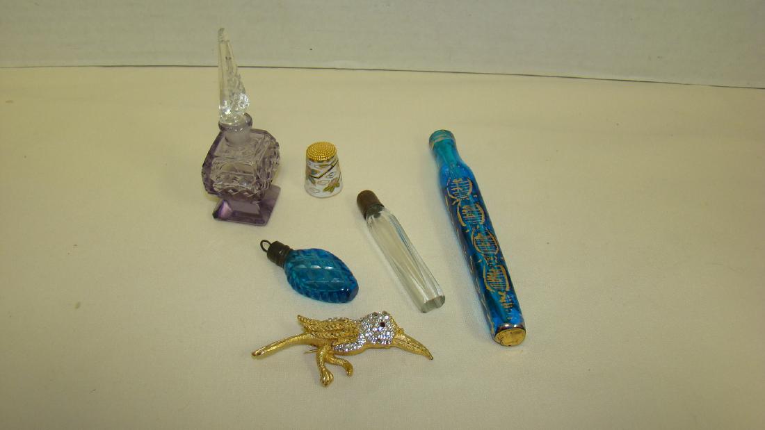 VINTAGE PERFUME BOTTLES AND MORE: VINTAGE PERFUME BOTTLES - CUT CRYSTAL PURLE GLASS WITH CLEAR CUT GLASS STOPPER - CHIP AT VERY TOP OF STOPPER - BLUE CUT GLASS BOTTLE WITH SCREW ON TOP THAT CAN BE HUNG FROM A CHAIN - TWO ADDITION BOTT