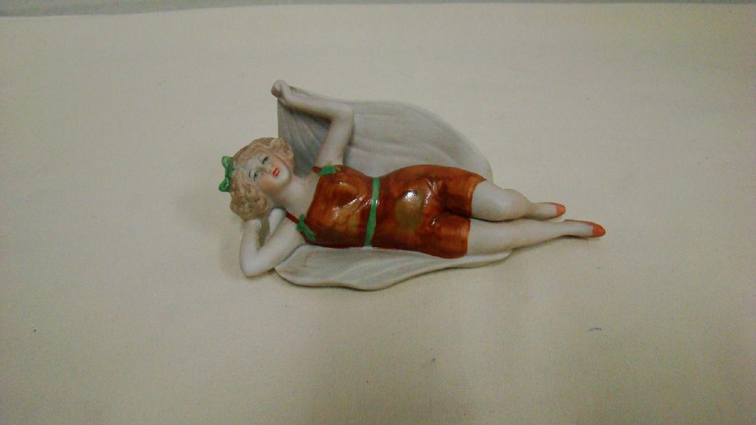 BISQUE BATHING BEAUTY-ULTRA RARE: BISQUE BATHING BEAUTY-ULTRA RARE-GERMAN MADE-GLAZED SUIT WITH BROWN AND GREEN ON BEACH BLANKET-CROWN MARK 7923-GOOD CONDITION