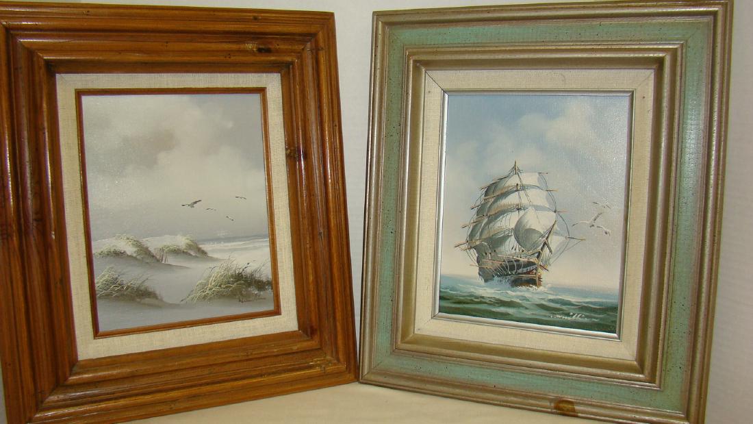 2 BEAUTIFULLY WOODEN FRAMED AND SIGNED OIL PAINTIN: 2 BEAUTIFULLY WOODEN FRAMED AND SIGNED OIL PAINTINGS - ONE IS OF AN OLD SHIP UNDER SAIL ON THE OCEAN WITH SEA GULLS IN THE AIR PAINTINGS HAS A FABRIC MAT IN A WOODEN FRAME PAINTED IN GREEN AND SILVER/