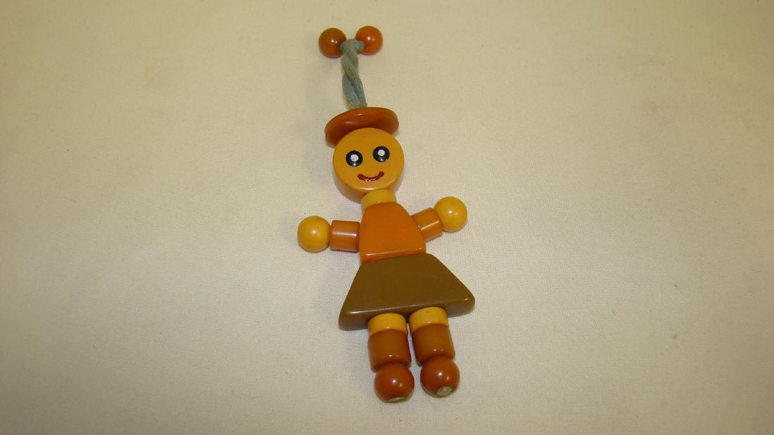 ANTIQUE BAKELITE BABY CRIB RATTLE FIGURE: ANTIQUE BAKELITE BABY CRIB RATTLE FIGURE-BUTTERSCOTCH-BROWN-OLIVE-GREAT CONDITION